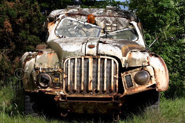 Rusty old car left to decay
